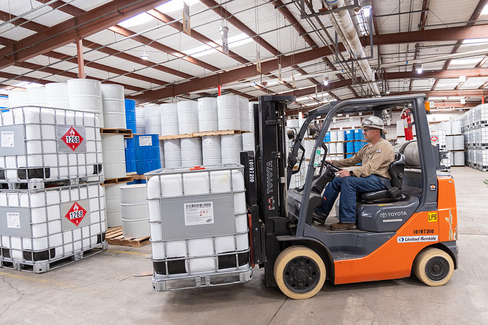 Supplier works in a warehouse with a forklift 